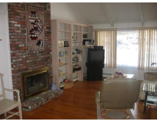 20 Axdell Road Sudbury, MA 01776 - Photo 9 of 17 a kitchen with a refrigerator and a table