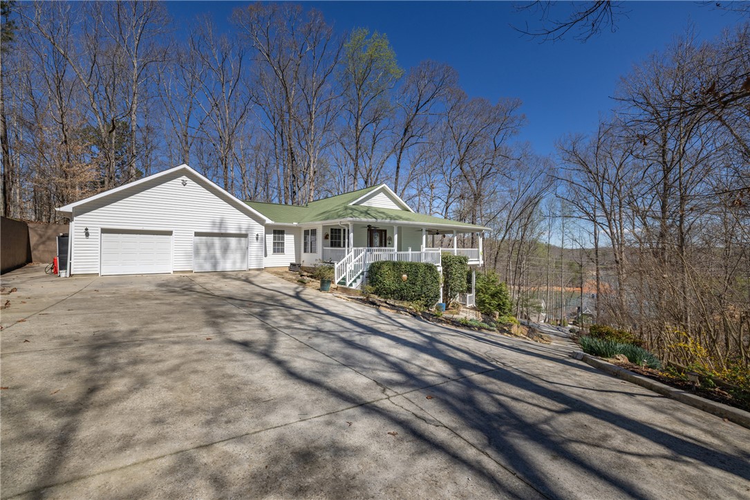 204 Riverlake Road Fair Play, SC 29643 - Photo 4 of 50 Perched amidst nature's beauty, this charming residence offers a serene escape with scenic views.