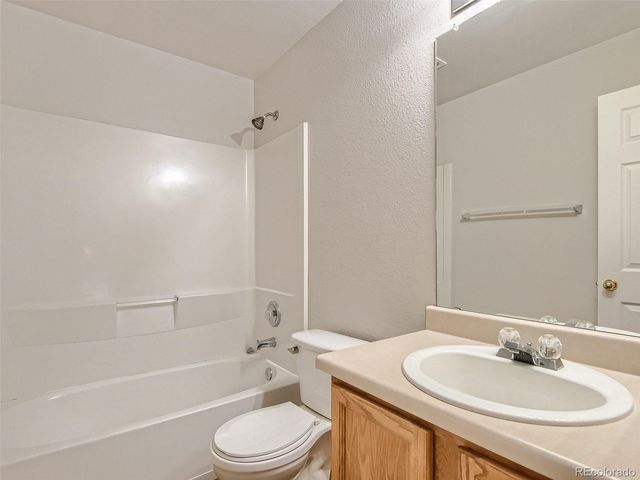 a bathroom with a sink a toilet and a bathtub