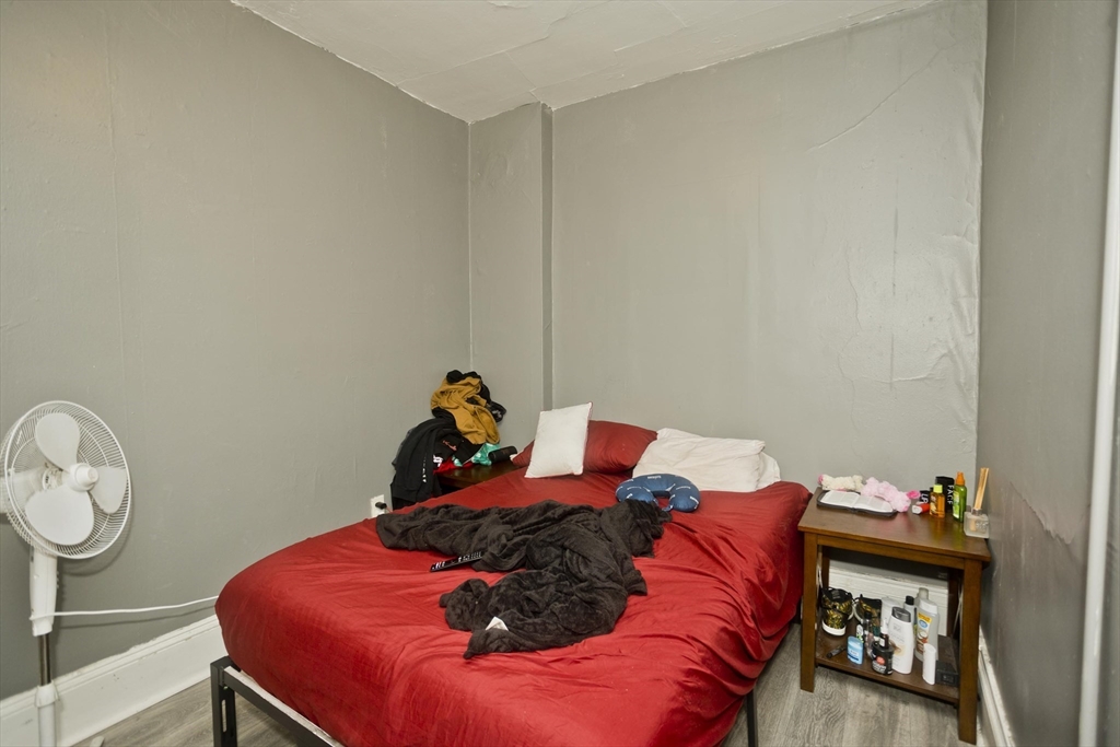 89-95 School Street Chicopee, MA 01013 - Photo 13 of 39 a bed room with a bed and a closet