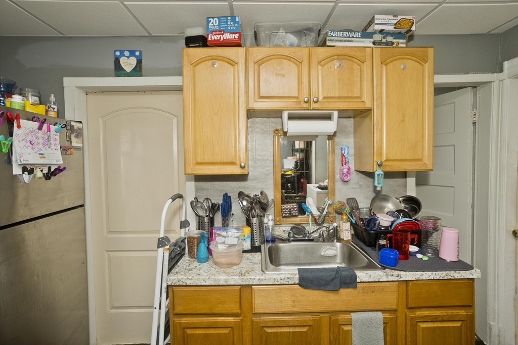 89-95 School Street Chicopee, MA 01013 - Photo 19 of 39 a bathroom with a sink and a mirror