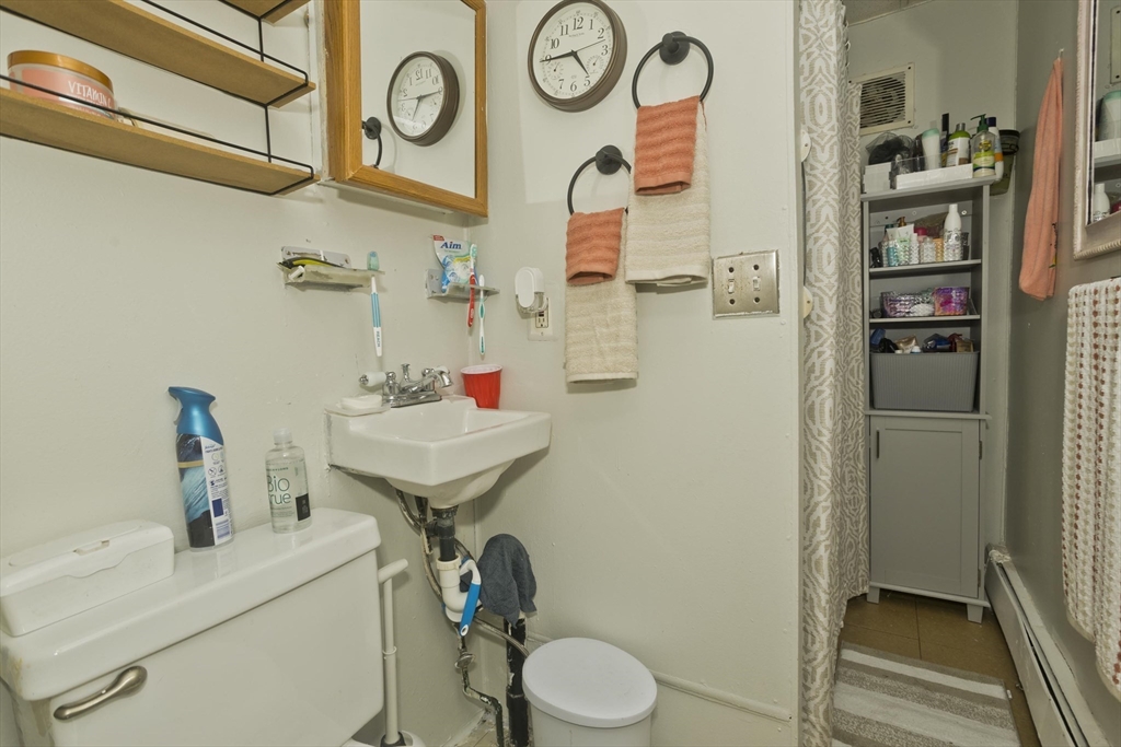 89-95 School Street Chicopee, MA 01013 - Photo 20 of 39 a bathroom with a sink toilet and shower