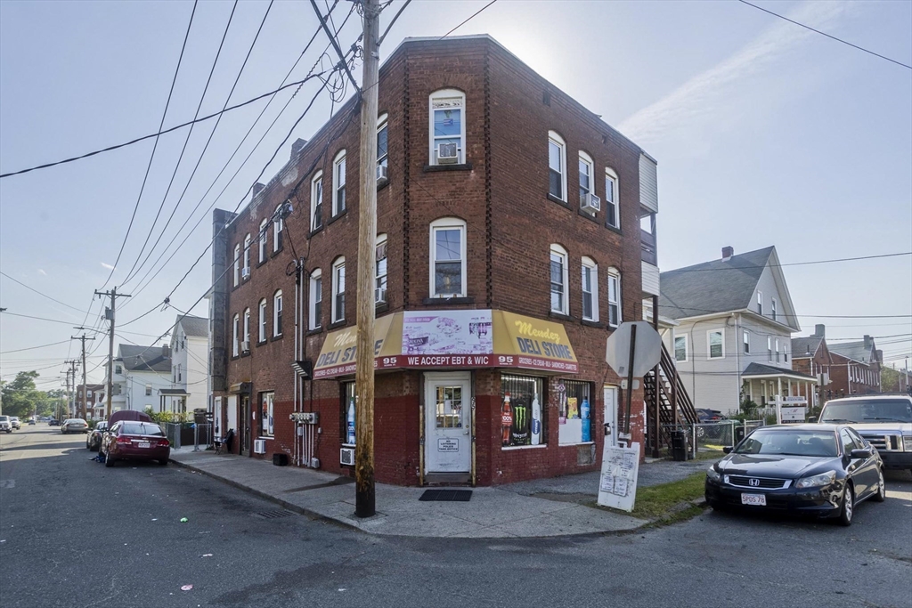 89-95 School Street Chicopee, MA 01013 - Photo 2 of 39 a view of a cars park in front of a building