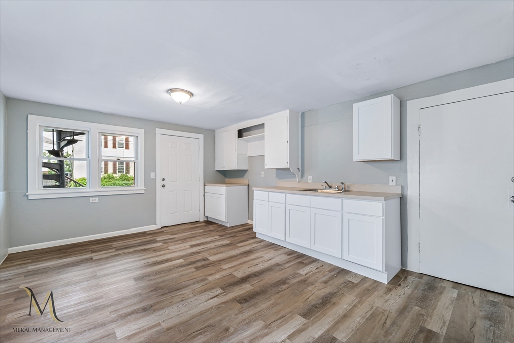 89-95 School Street Chicopee, MA 01013 - Photo 3 of 39 a kitchen with sink and window