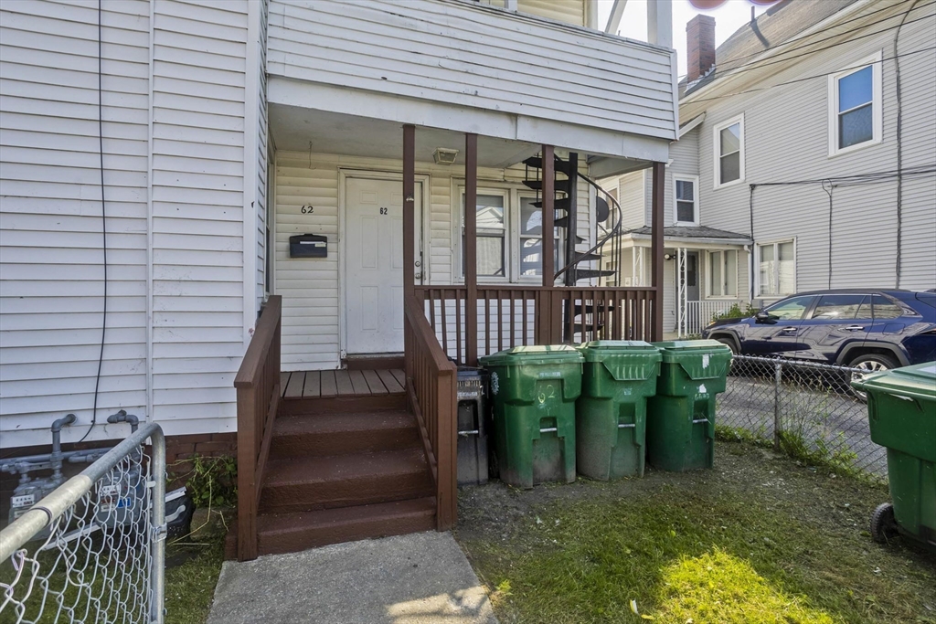 89-95 School Street Chicopee, MA 01013 - Photo 33 of 39 a view of a patio with table and chairs with wooden fence