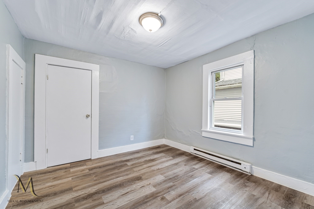 89-95 School Street Chicopee, MA 01013 - Photo 5 of 39 an empty room with a empty space and windows