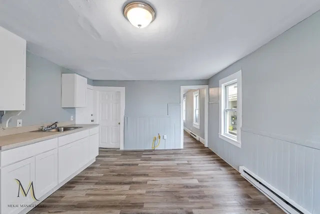 a room with a sink and a window