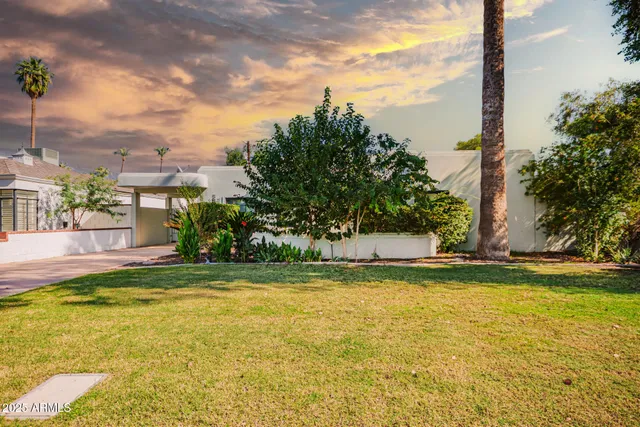 a view of a swimming pool with a yard