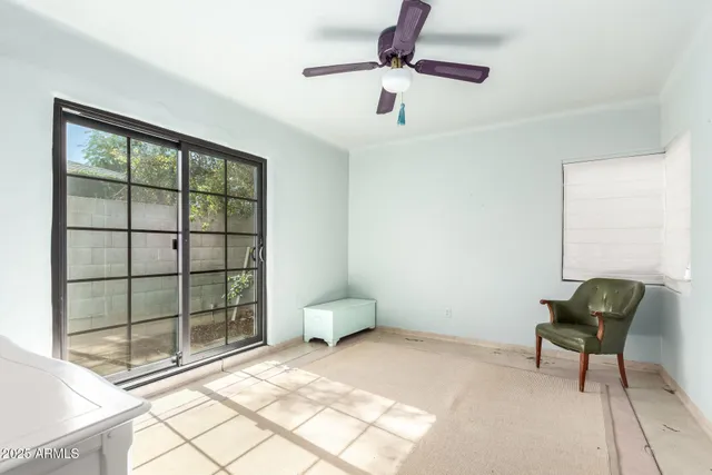 a bedroom with furniture and a window