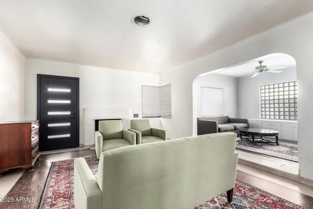 a living room with furniture and a large window