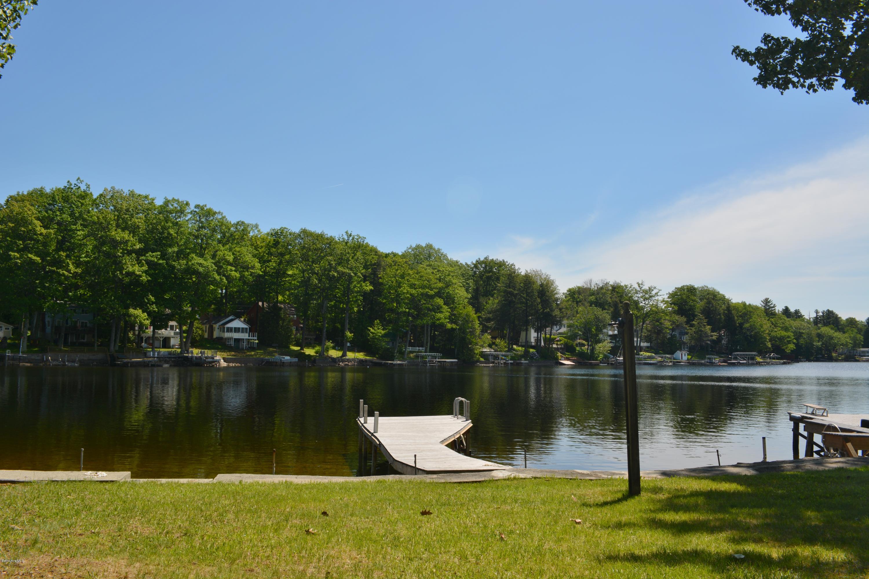87 North Gate Island Road Otis, MA 01029 - Photo 12 of 15 a view of a lake with houses in the back