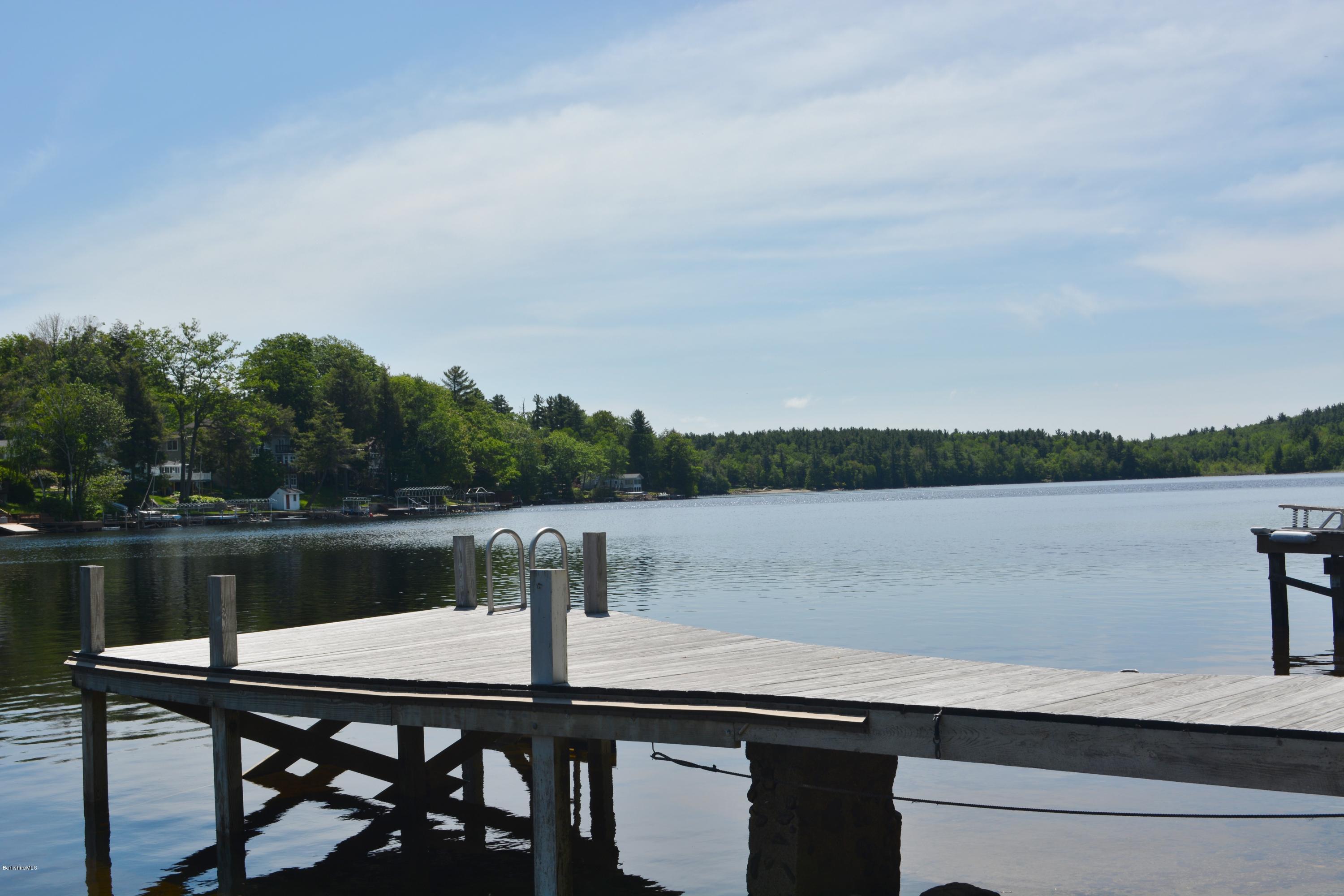 87 North Gate Island Road Otis, MA 01029 - Photo 13 of 15 a view of a lake with a table and chairs