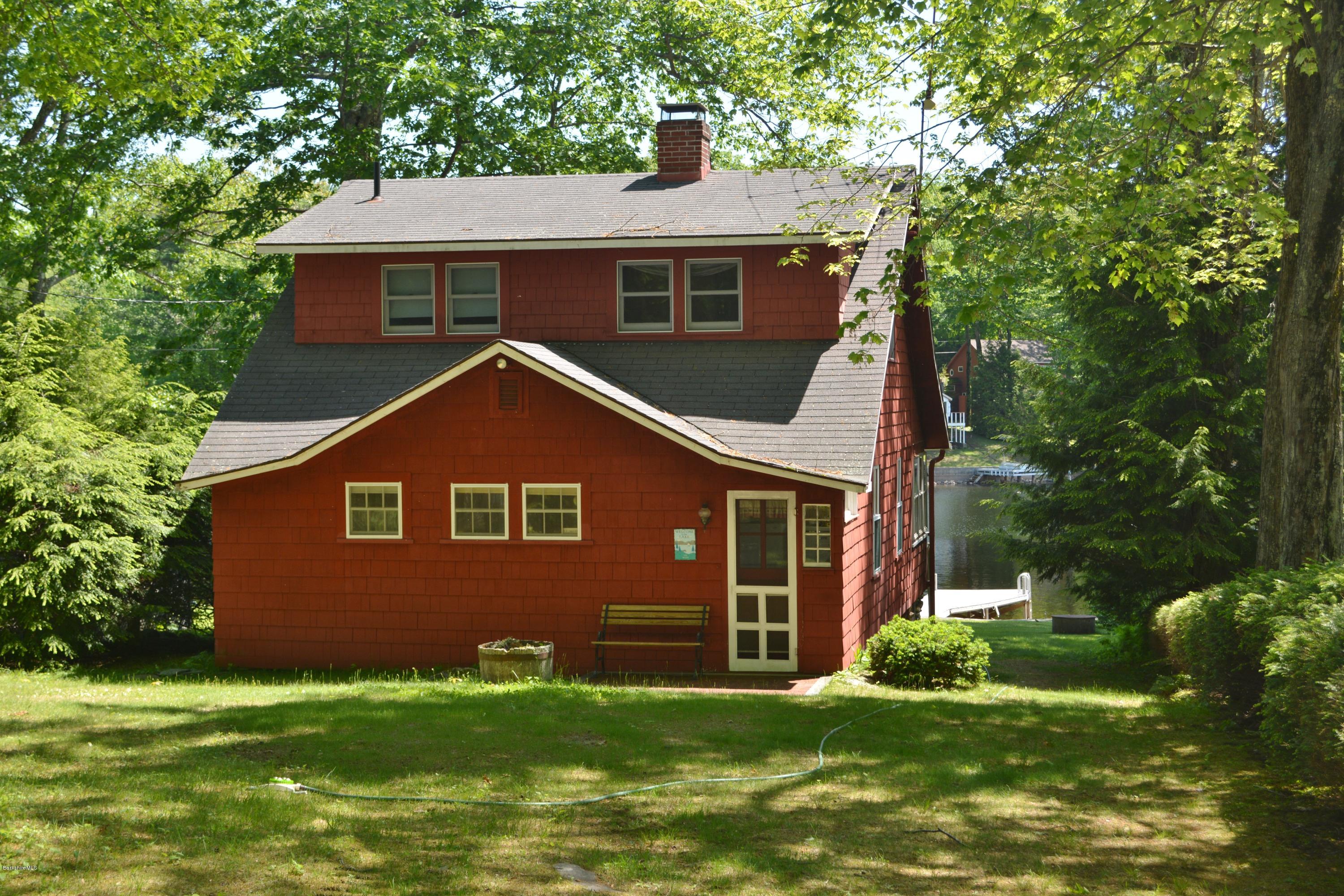 87 North Gate Island Road Otis, MA 01029 - Photo 14 of 15 a front view of a house with a yard