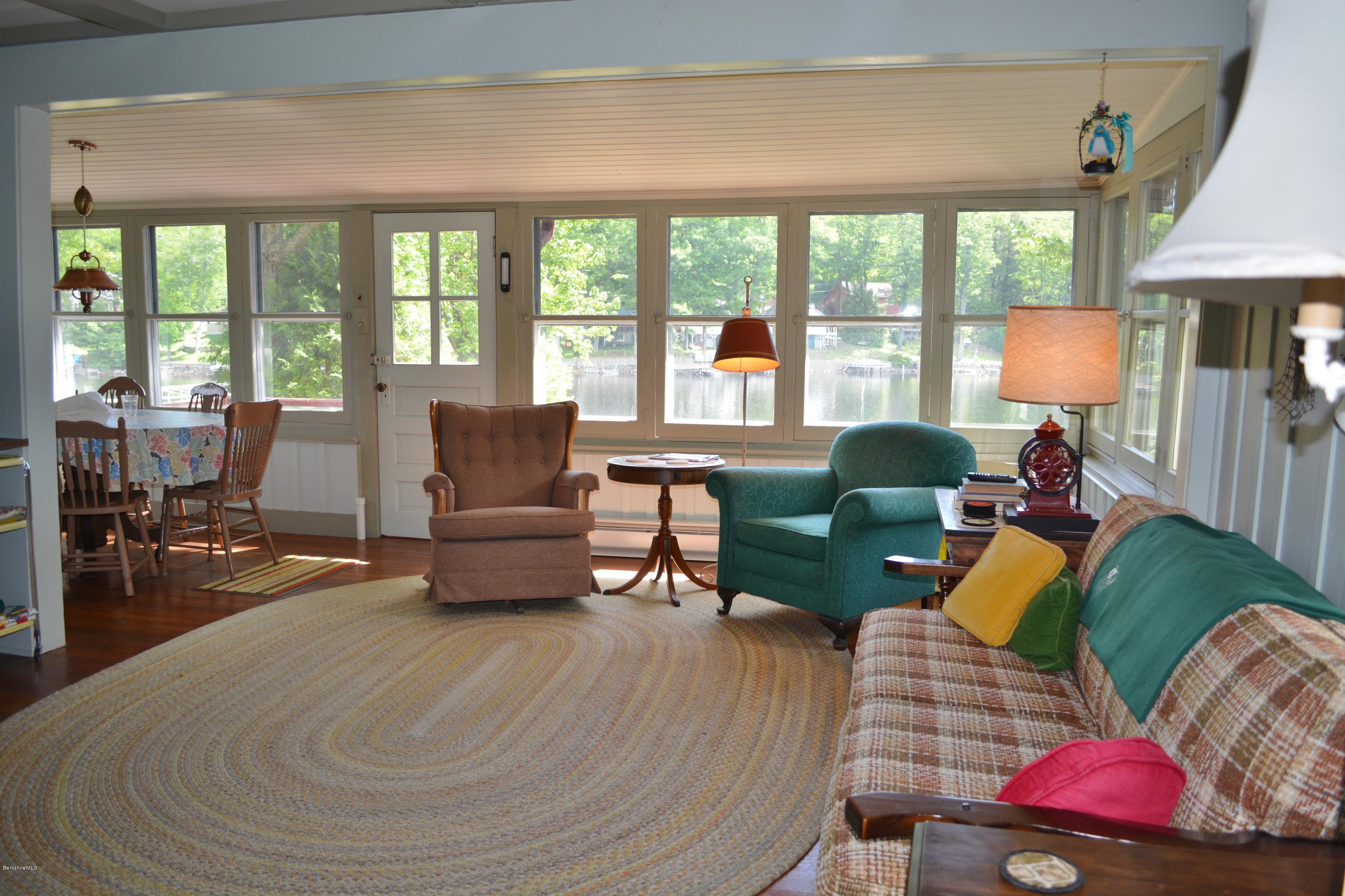87 North Gate Island Road Otis, MA 01029 - Photo 5 of 15 a living room with furniture and a large window