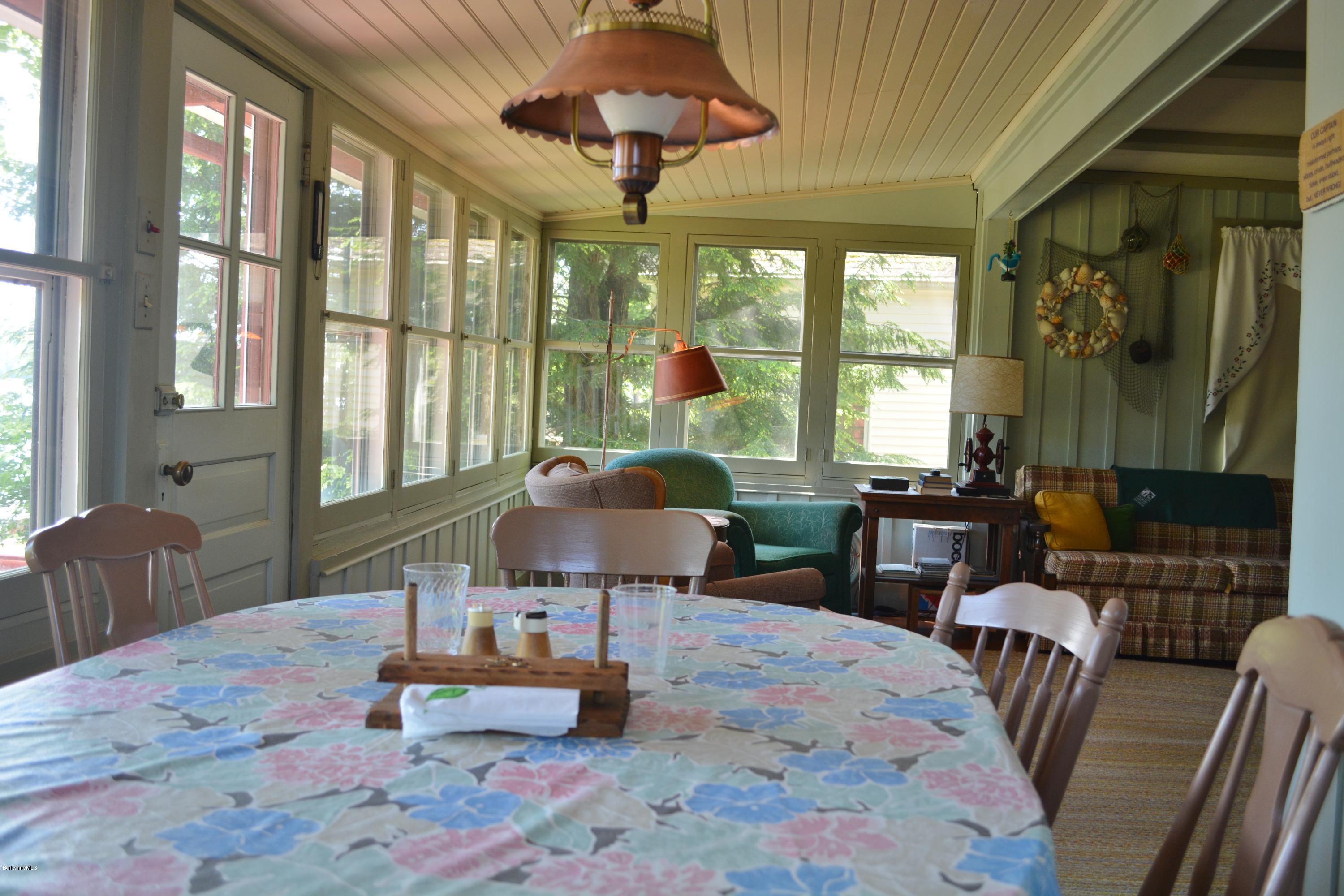 87 North Gate Island Road Otis, MA 01029 - Photo 7 of 15 a living room with furniture and a large window