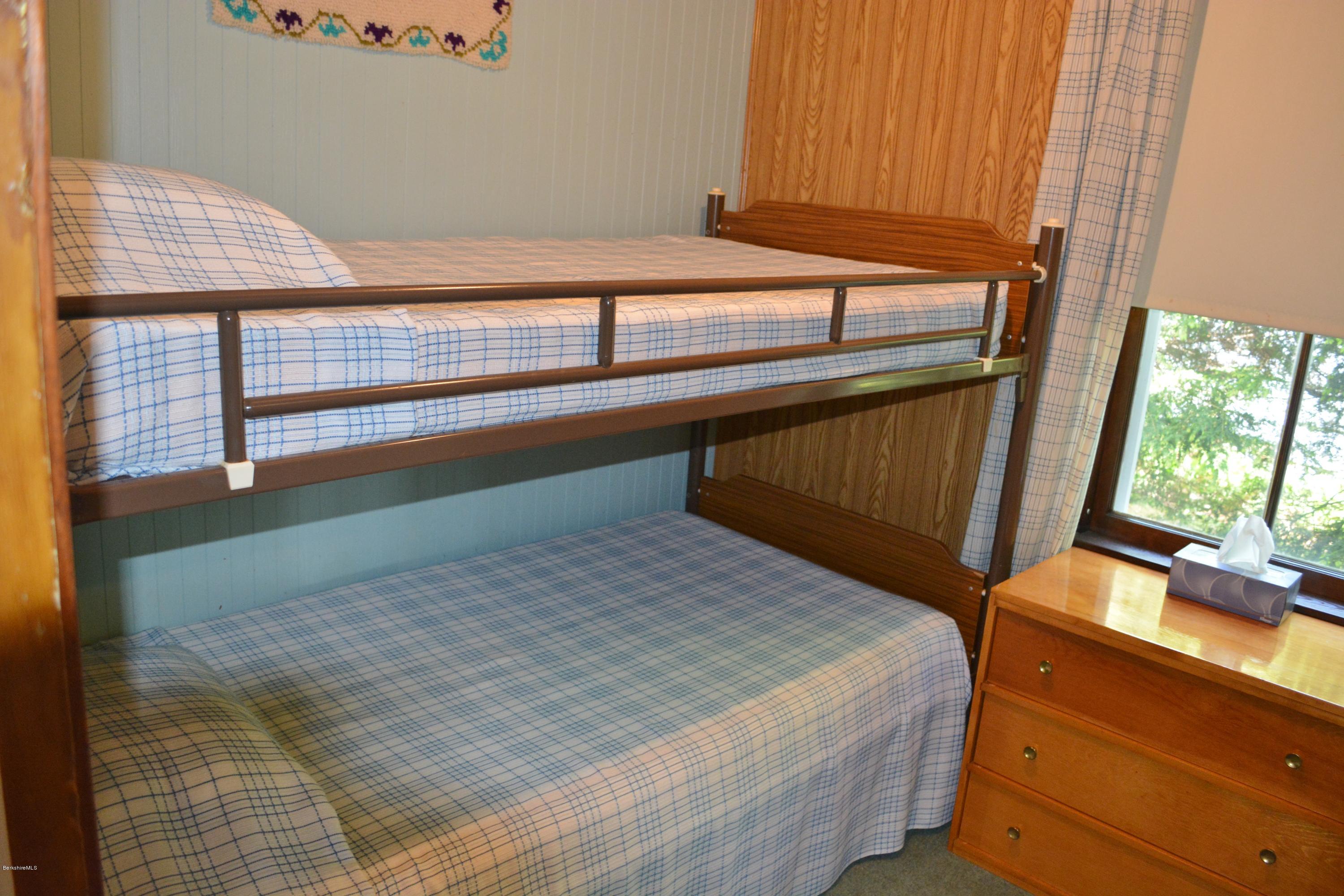 87 North Gate Island Road Otis, MA 01029 - Photo 9 of 15 a bedroom with a bed and a window