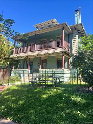 front view of a house with a garden