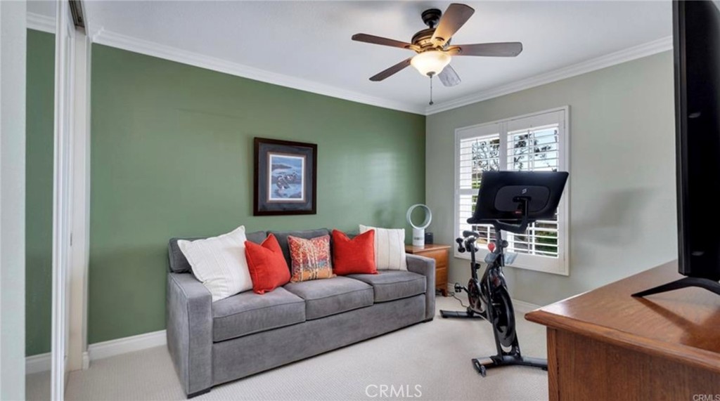 8 Oakgrove, Unit 54 Irvine, CA 92604 - Photo 11 of 14 a living room with furniture and a flat screen tv