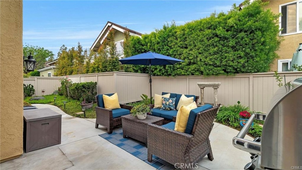 8 Oakgrove, Unit 54 Irvine, CA 92604 - Photo 13 of 14 a view of backyard with outdoor seating and plants