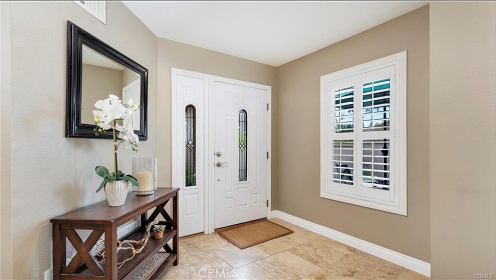 8 Oakgrove, Unit 54 Irvine, CA 92604 - Photo 2 of 14 a view of an entryway with wooden floor