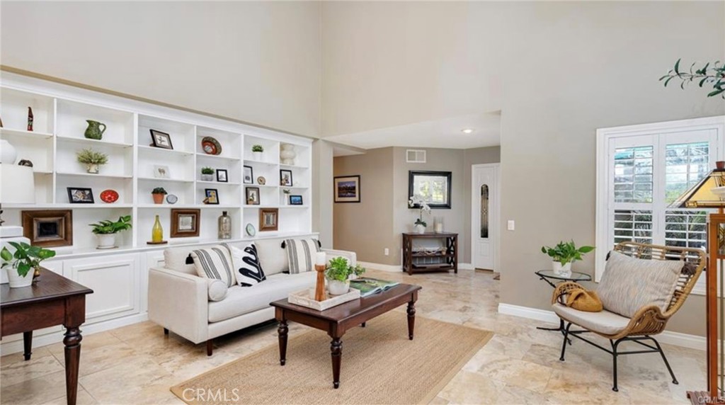 8 Oakgrove, Unit 54 Irvine, CA 92604 - Photo 4 of 14 a living room with furniture and a potted plant