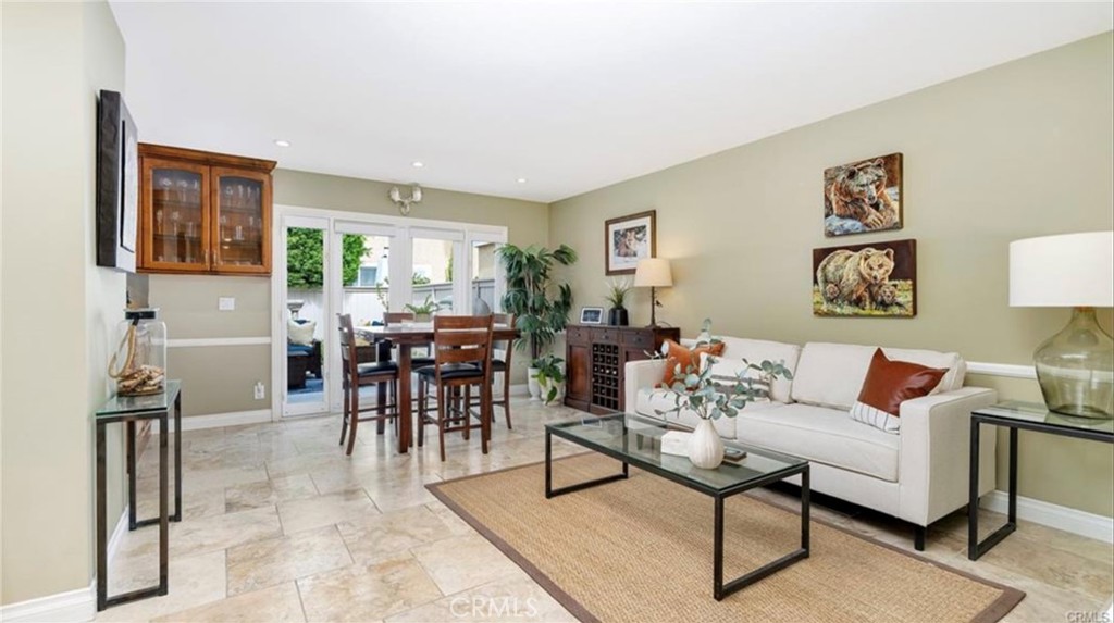 8 Oakgrove, Unit 54 Irvine, CA 92604 - Photo 6 of 14 a living room with furniture potted plant and a window