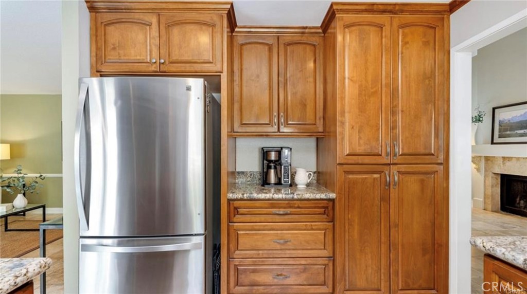8 Oakgrove, Unit 54 Irvine, CA 92604 - Photo 8 of 14 a kitchen with stainless steel appliances granite countertop a refrigerator and cabinets