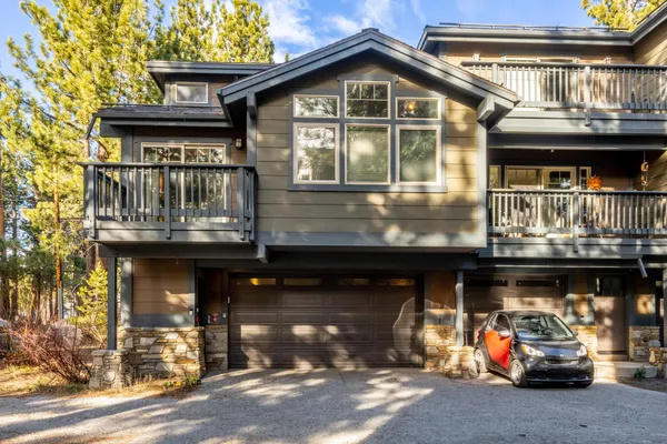 a front view of a house with parking