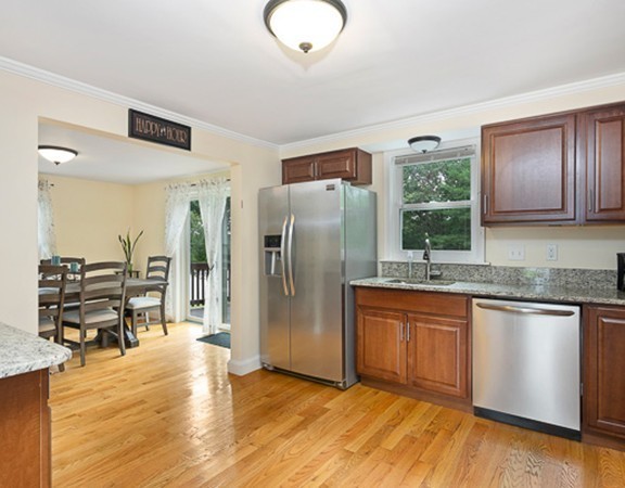 80 Hillcrest Road Waltham, MA 02451 - Photo 1 of 20 a kitchen with stainless steel appliances granite countertop a refrigerator and a stove top oven