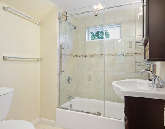80 Hillcrest Road Waltham, MA 02451 - Photo 11 of 20 a bathroom with a sink mirror toilet and bathtub