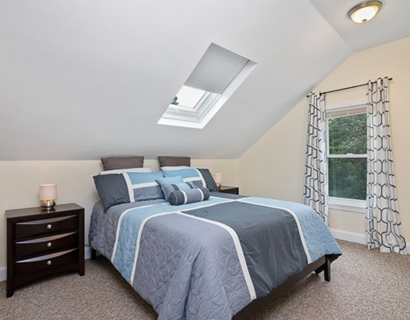 80 Hillcrest Road Waltham, MA 02451 - Photo 8 of 20 a bedroom with a bed and a window