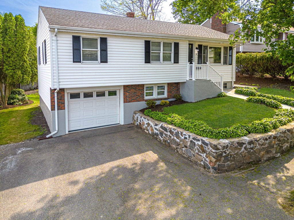 6 Glen Road Peabody, MA 01960 - Photo 1 of 35 a front view of a house with a garden and yard