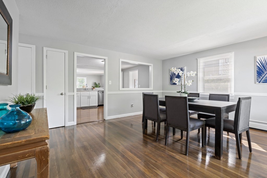 6 Glen Road Peabody, MA 01960 - Photo 11 of 35 a view of a dining room with furniture and wooden floor