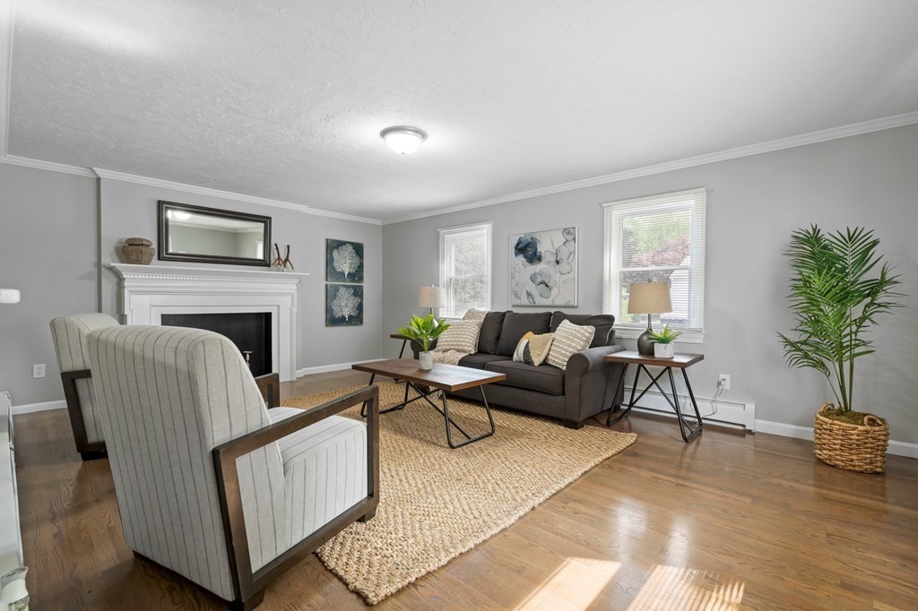 6 Glen Road Peabody, MA 01960 - Photo 13 of 35 a living room with furniture and a fireplace