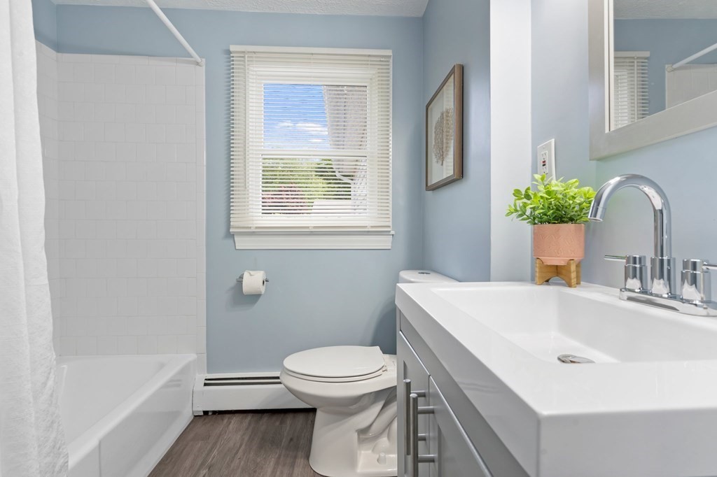 6 Glen Road Peabody, MA 01960 - Photo 14 of 35 a bathroom with a sink a toilet and shower