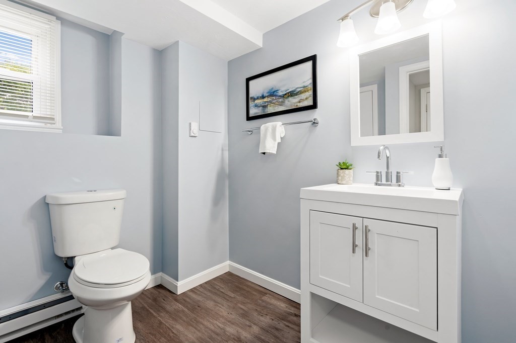 6 Glen Road Peabody, MA 01960 - Photo 20 of 35 a bathroom with a toilet sink and mirror