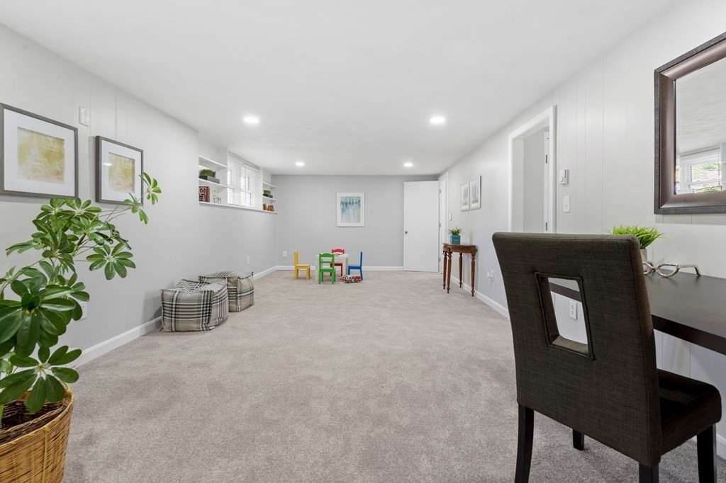 6 Glen Road Peabody, MA 01960 - Photo 26 of 35 a room with furniture and potted plant