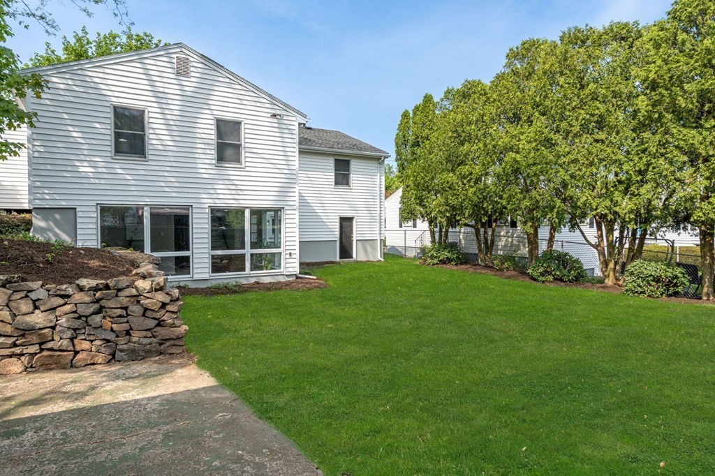 6 Glen Road Peabody, MA 01960 - Photo 30 of 35 a front view of a house with a garden