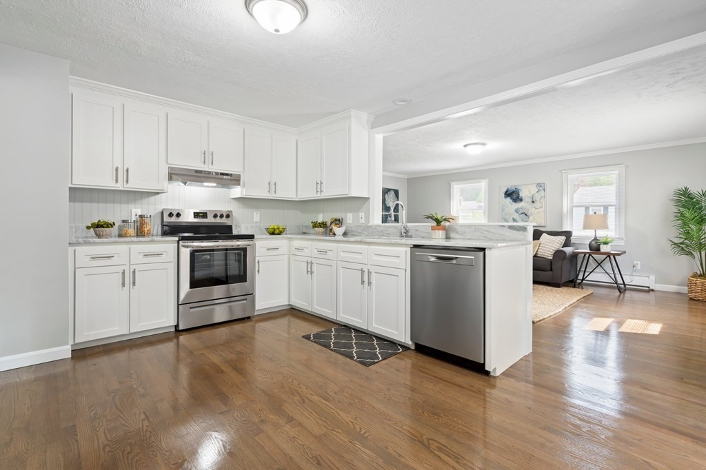 6 Glen Road Peabody, MA 01960 - Photo 5 of 35 a kitchen with a sink cabinets and wooden floor