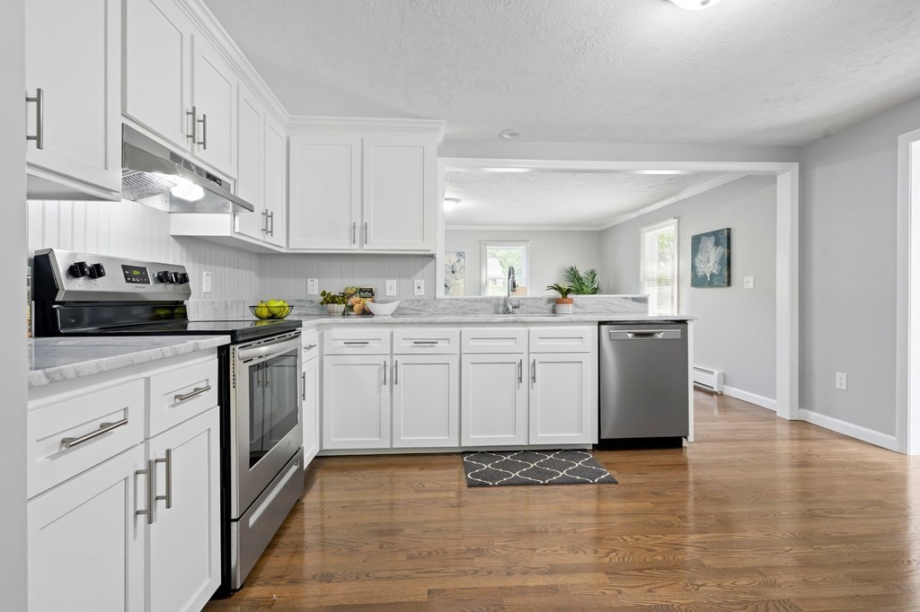 6 Glen Road Peabody, MA 01960 - Photo 6 of 35 a kitchen with a sink cabinets and wooden floor