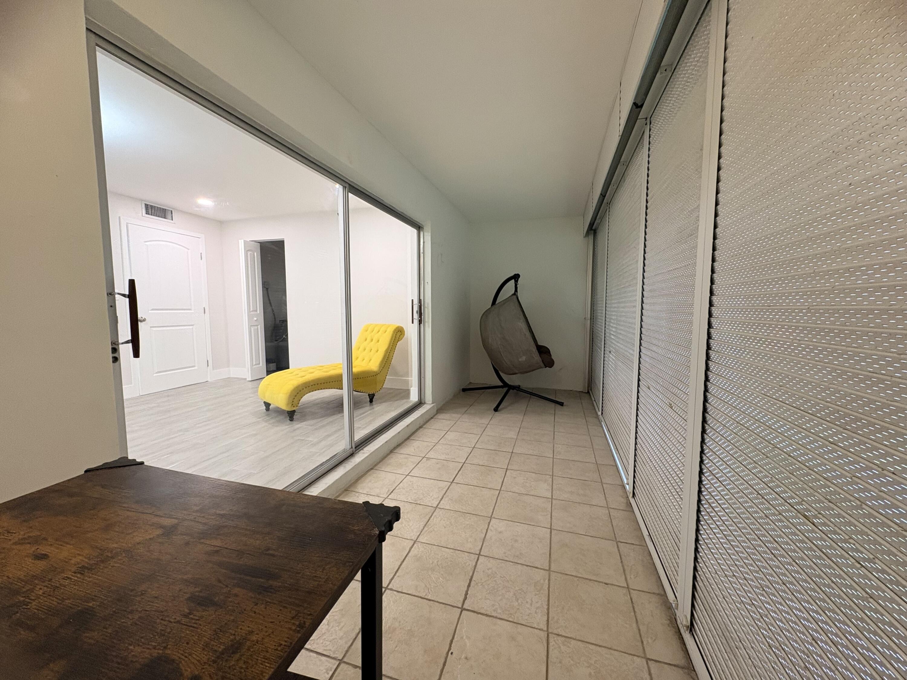 2202 Northeast 36th Street, Unit 17 Lighthouse Point, FL 33064 - Photo 23 of 28 Patiolookingintobedroom