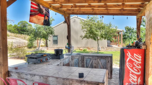 a living room with furniture a window and a clock