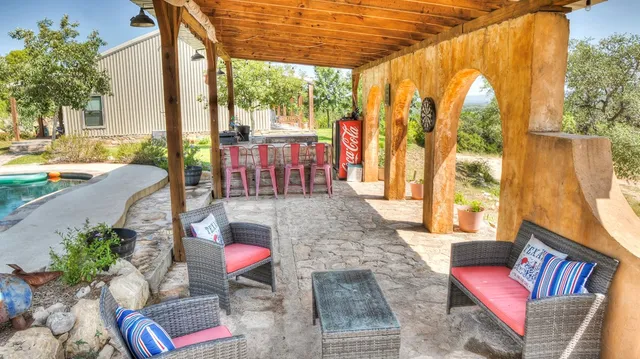 a dining room with furniture a window and a chandelier