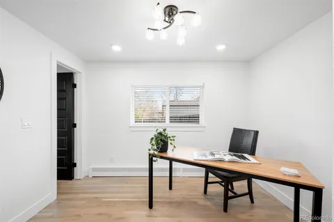 a workspace with furniture and window