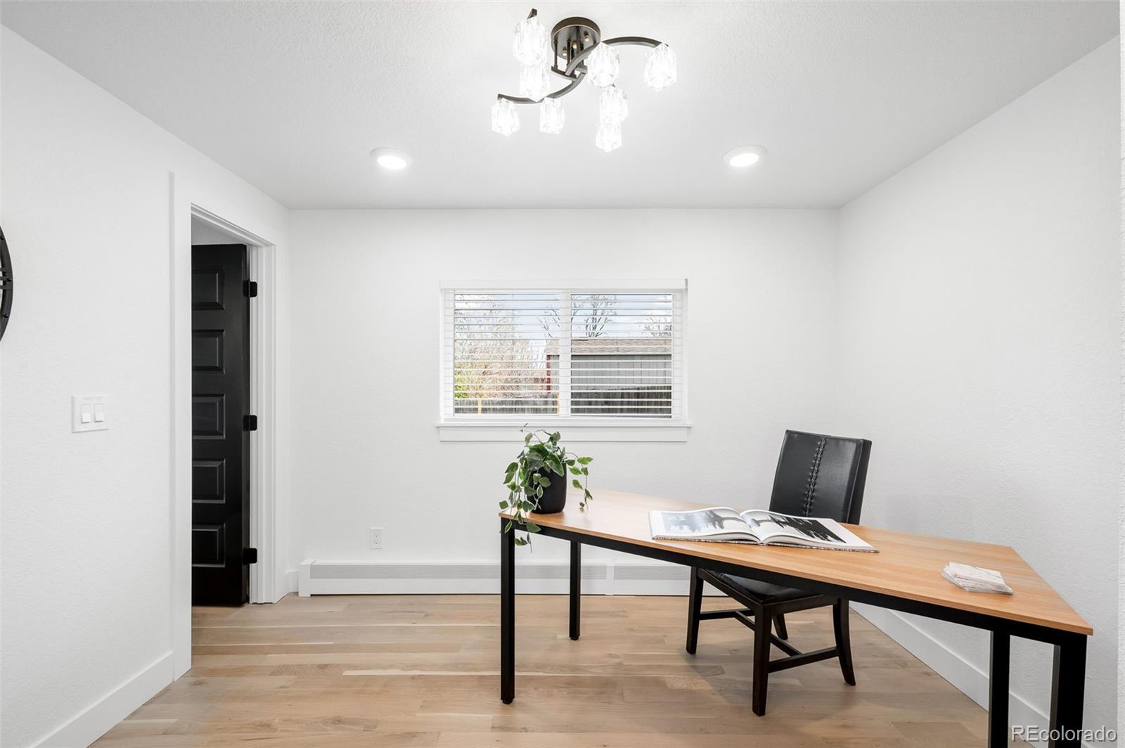 3860 Dudley Street Wheat Ridge, CO 80033 - Photo 15 of 38 a workspace with furniture and window