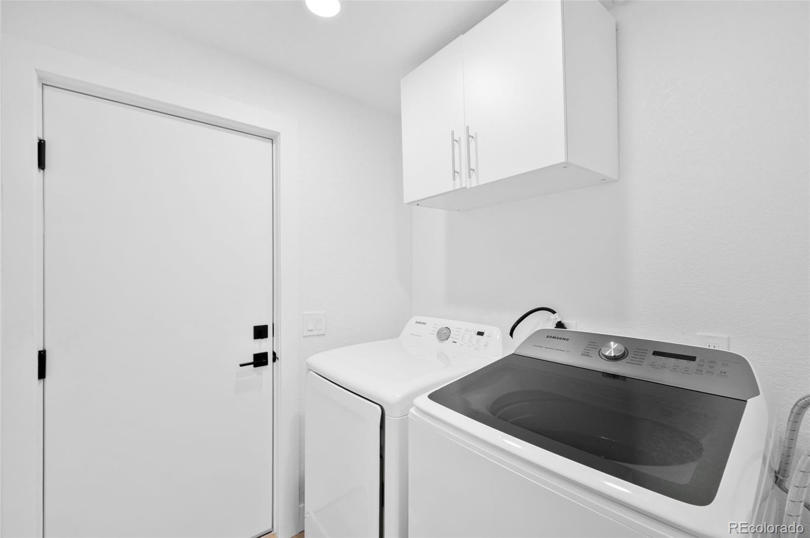 3860 Dudley Street Wheat Ridge, CO 80033 - Photo 30 of 38 a utility room with dryer and washer
