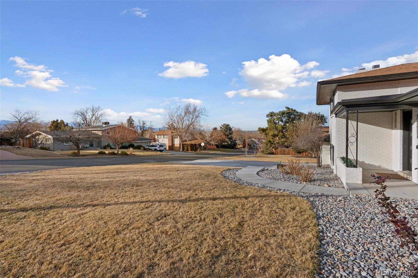 3860 Dudley Street Wheat Ridge, CO 80033 - Photo 31 of 38 a view of houses with sky view
