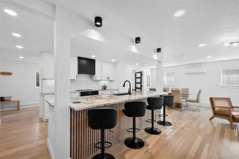 a view of a kitchen with dining table and workspace