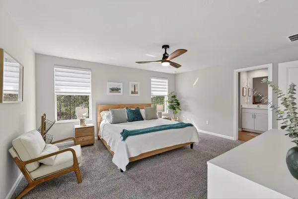 a bedroom with a bed and a dresser