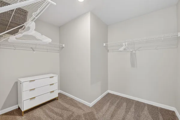 a bathroom with a double vanity sink and mirror